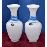 Pair of Saint-Louis opaque glass snakes vases with blue trail decoration, signed, 8" high; each with