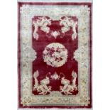 Chinese silk dragon design red ground rug, 73" x 48" approx