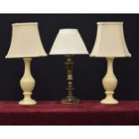 Pair of faux marble table lamps with shades, 20" high overall; together with a brass table lamp with