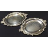 Pair of Elkington silver plated oval meat serving plates, with cast foliate and sheep head mounts