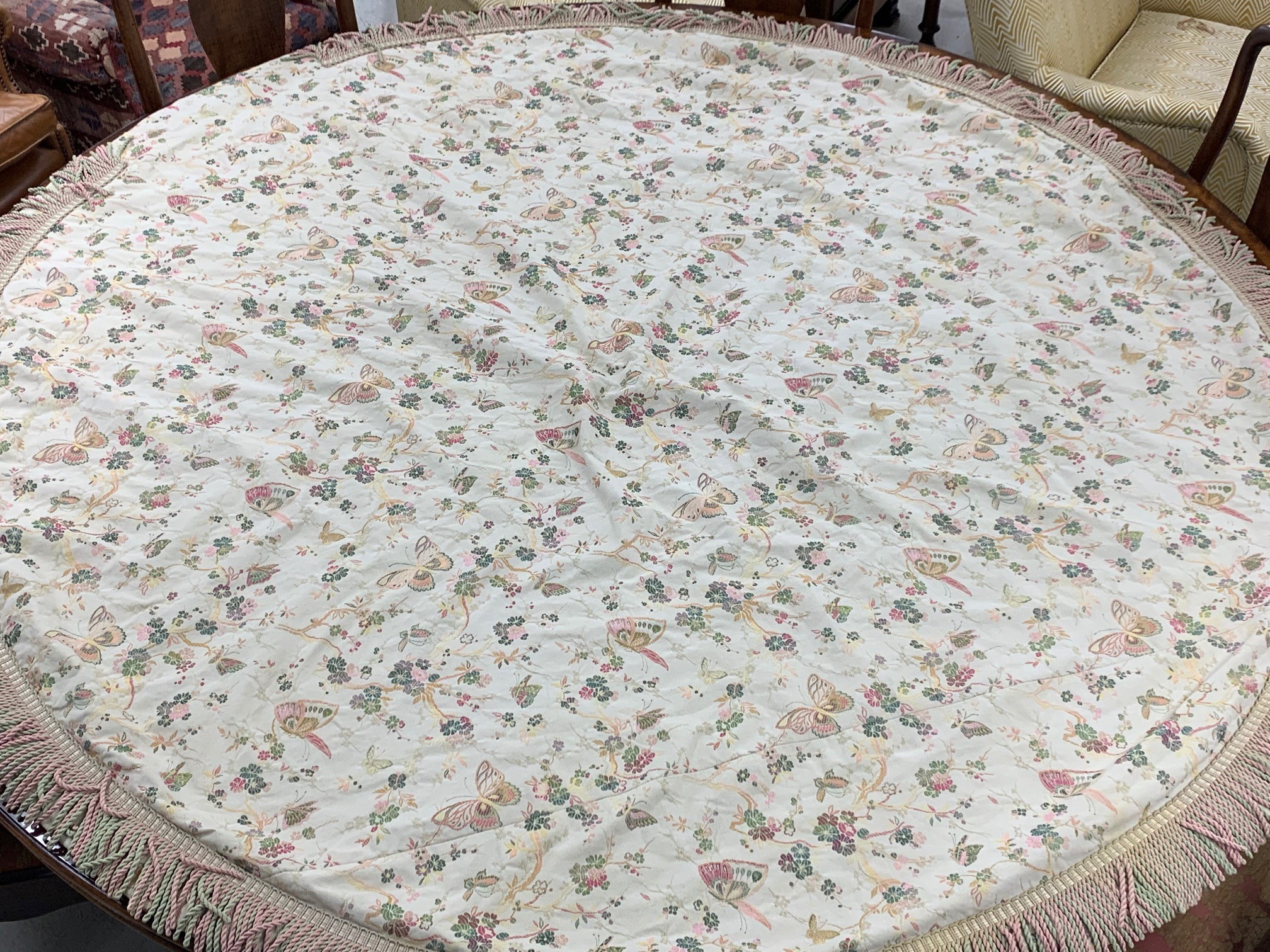 Pair of round lined table cloths with butterfly designs and fringed borders, 80" diameter approx (2)