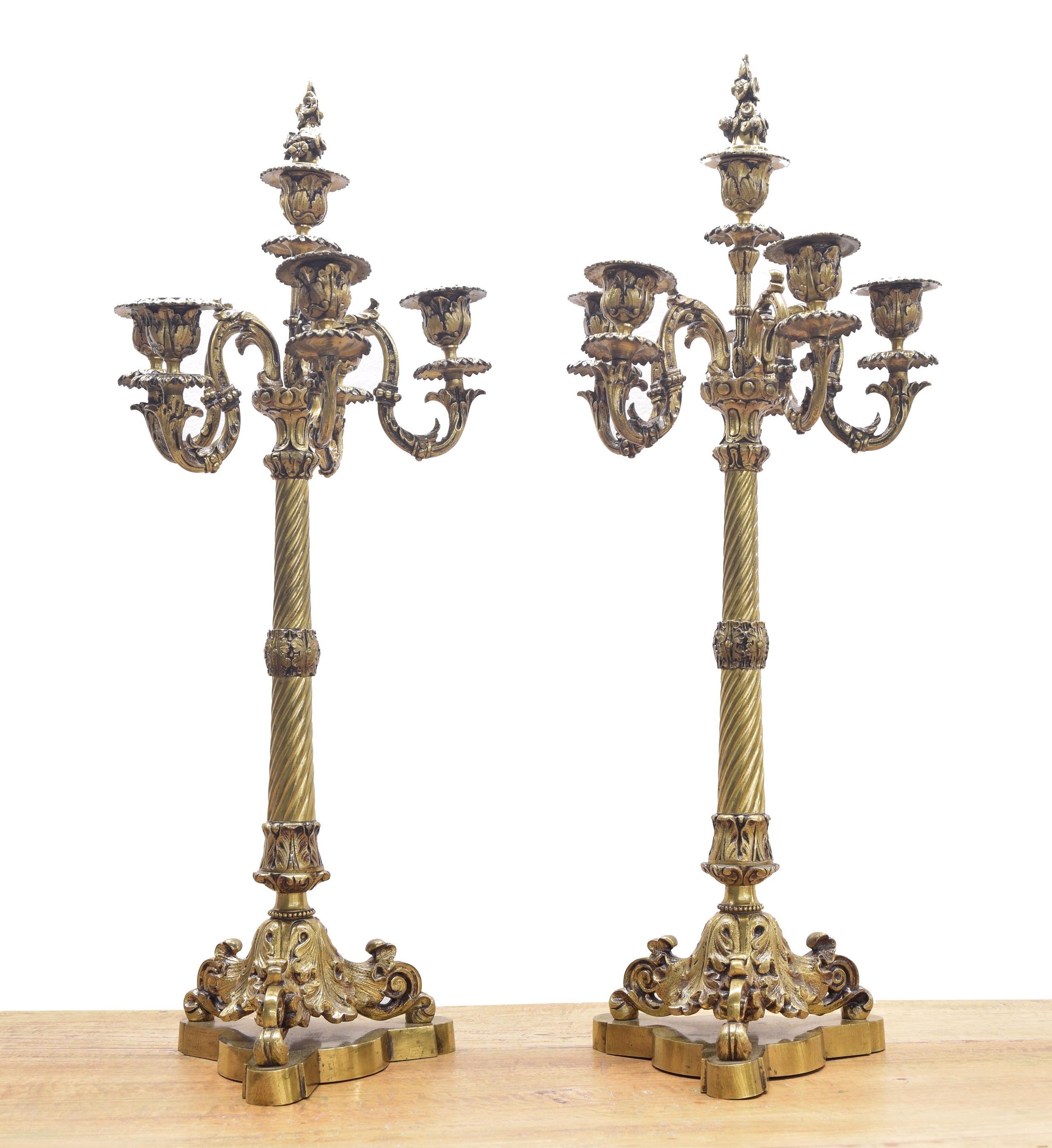 Pair of decorative French cast gilt metal candelabra, each with five candle sconces upon a wrythen