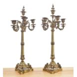 Pair of decorative French cast gilt metal candelabra, each with five candle sconces upon a wrythen