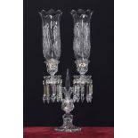 Baccarat twin-branch candelabrum with etched storm shades, the sconces with facetted drops drops,