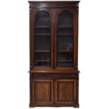 Good quality Dutch walnut and ebonised bookcase cabinet, late 19th century, with a pair of arched