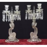 Pair of Baccarat twin-sconce glass candlesticks, the drip-pans with pendant lustre drops upon