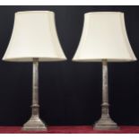Large pair of silvered Corinthian column table lamps upon square stepped bases, with white shades,