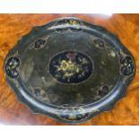 Large Victorian papier maché oval shaped tray, painted with reserves of flowers within gilt