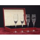 Set of four Cartier champagne glass flutes in a Cartier box, each signed, 9" high