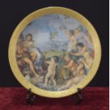 Large Continental porcelain charger decorated with a classical cherub scene within gilded embossed