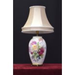 Noritake ovoid porcelain and gilt metal table lamp with shade, decorated with flowers, signed S.