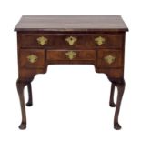 George II walnut lowboy, the crossbanded top over four freeze drawers upon cabriole legs, 29.5"