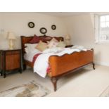 Pair of French burr walnut serpentine marble top bedside cabinets; together with a matching double