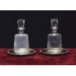 Pair of Baccarat 'Lorraine' clear glass carafes and stoppers, etched mark, each 10" high; mounted