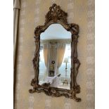 Larger ornate giltwood foliate framed wall mirror, 28" wide, 48" high
