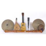 Collection of various instruments including a bass recorder, single horn, ukulele, small bandora,
