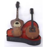 Austrian shield shaped mandolin; also a round bodied mandolin, both cased (2)