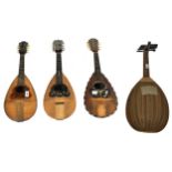 Three old Neapolitan mandolins in need of restoration, one labelled Carlo Cristini and the other two
