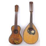 Six string ukulele with painted decoration to the table; also a twelve string flatback pear shaped