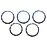 Rolex - two black bezel inserts; together with three blue bezel inserts (5)