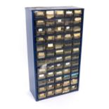 Quantity of various watch parts contained within a sixty drawer storage unit to include bolt screws,