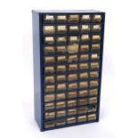 Sixty drawer storage unit containing a quantity of various sized watch glasses