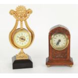 Small gilt metal lyre shaped clock timepiece upon a square canted base, 8.5" high; also a small