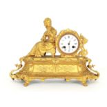 French gilt metal two train figural mantel clock striking on a bell, the 3" white dial within a