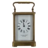 French carriage clock striking on a gong, within a corniche brass case, 6.5" high; also with outer