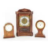 Oak two train mantel clock, the 7.25" square brass dial with silvered chapter ring, within a