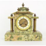 French green onyx two train mantel clock striking on a gong, the 3.75" cream chapter ring signed