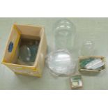 Large quantity of various size clock glasses and two small domes