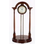 Mahogany cased portico gravity clock, the 2.25" white dial inscribed Pat 23149-10, within a globe