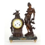 French bronzed two train figural mantel clock striking on a bell, the 3" white dial within an ornate