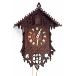 Black Forest two train cuckoo clock by Philip Haas, the 5" dial within a chalet carved case, 18.5"