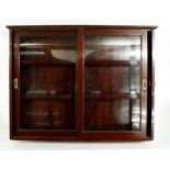 Great Western Railway (G.W.R) mahogany wall cabinet, fitted with two sliding glazed doors and