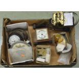 Cardboard tray containing miscellaneous horological items, including new pendulum bobs, small