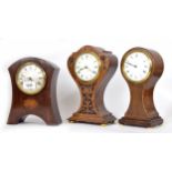 Art Nouveau style small carved oak mantel clock timepiece with platform escapement, within a foliate