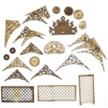 Large quantity of various pierced brass spandrels; also a small quantity of pierced brass clock side