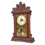 Seth Thomas mahogany gingerbread two train shelf clock striking on a gong and bell, the 5" white