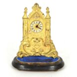 Small German gilded brass Zappler Clock, in the form of a church front repousse with scrolling