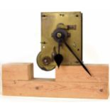 Single fusee movement with pendulum and hands, mounted upon a wooden block, 9.5" high overall