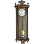 Walnut and ebonised single weight Vienna regulator wall clock, the 6.25" white enamel dial with