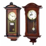 Two contemporary Highlands small wooden cased wall clocks, both 17.5" high (pendulums and keys) (2)