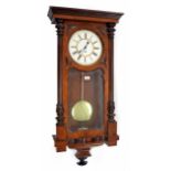 Walnut single weight Vienna regulator wall clock, the 9.5" white dial within a glazed case with