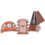 Small pottery mantel clock timepiece; also a wooden cased ticket clock, 6" high and a Maelzel walnut