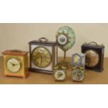Novelty mantel clock timepiece, the case modelled as a large bird's egg overlaid with foliage and