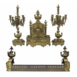 Large and impressive solid French brass two train mantel clock garniture with matching fire dogs and