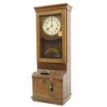 International Time Recording Co. Limited of London time recorder, within an oak glazed case, 39.