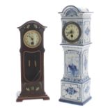 Miniature longcase clock, the 2" cream dial within a Dutch style blue and white pottery case with